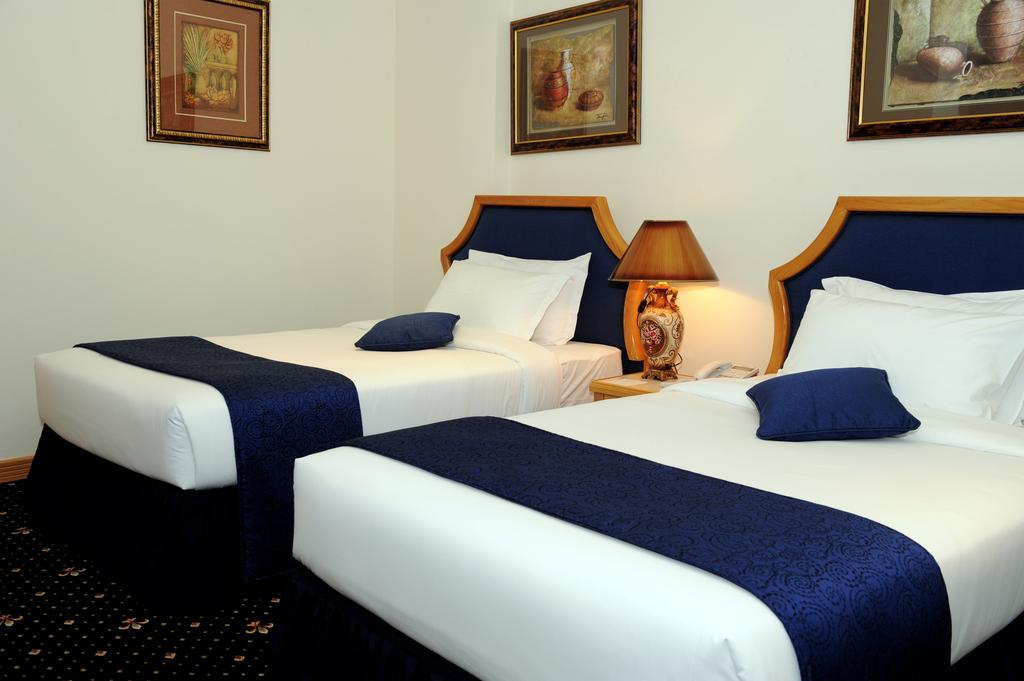 Cayam Hotel Doha Room photo